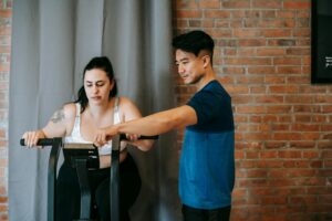 Personal training session - trainer motivating client