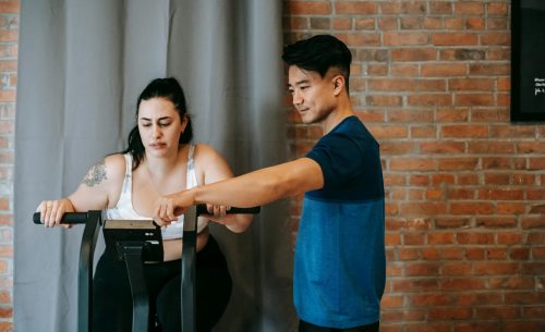 Personal training session - trainer motivating client